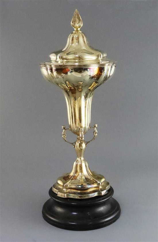 A George V silver gilt trumpet shaped trophy cup and cover, by Goldsmiths & Silversmiths Co Ltd, 52 oz.